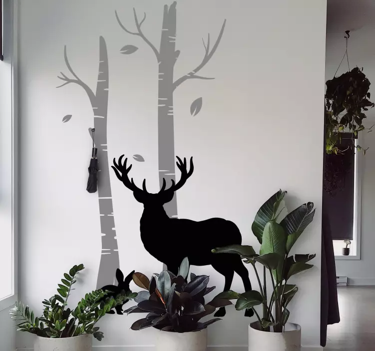 Sticker porte manteau cerfs près des arbres - TenStickers