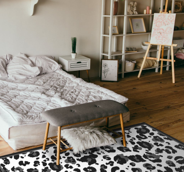 Tapis vinyle animal motif de taches noires - TenStickers